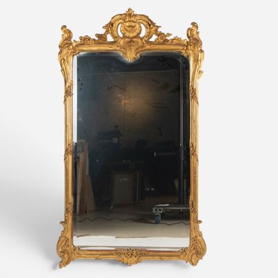 an image of a gold framed mirror on a white background