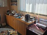 a desk with a laptop computer and a book on it