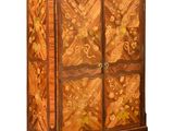 an image of a cabinet made of wood with flowers on it
