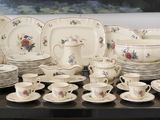 a table with a bunch of plates and cups on it