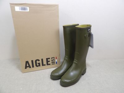 an image of a pair of green rain boots next to a box