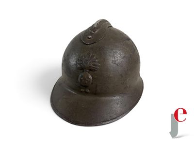 a helmet that is sitting on a white surface