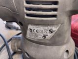 a close up of a sander on a table
