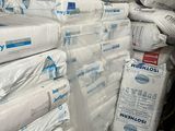 a large pile of white sheets stacked on top of each other