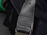 a close up of a motorcycle helmet with a leather strap