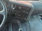 a car dashboard with a steering wheel and a control panel