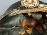 a close up of a helmet with a badge on it