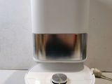 an image of a white coffee maker on a table