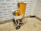 a yellow machine that is sitting in the middle of a room