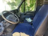 a blue seat in the back of a van
