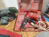 a red tool box with tools on a wooden table