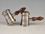 pair of antique pewware salt and pepper shakers with wooden handles