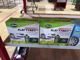 two boxes of flat tyre cleaner sitting on a shelf in a store