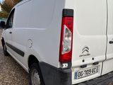 a white van that is parked on the side of the road