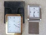 two watches and a wallet on the floor