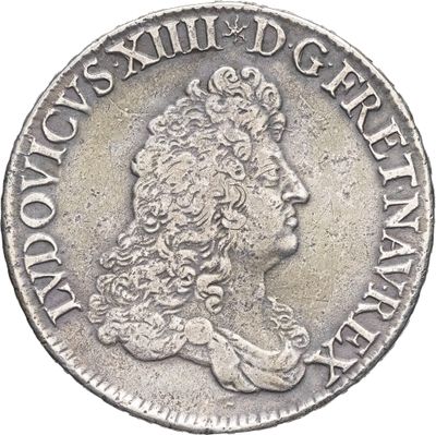 gros plan d'une pièce de monnaie sur laquelle figure une tête de femme