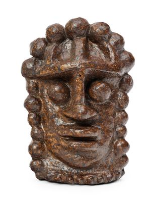 a close up of a statue of a man ' s face on a white background