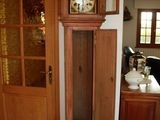 a grandfather clock in the corner of the room