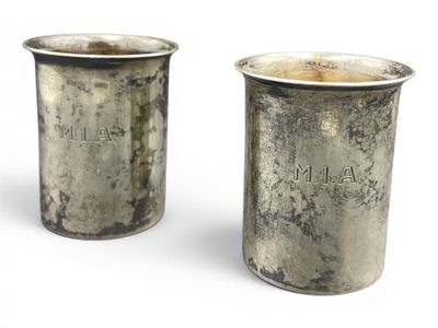 pair of antique silverplated cups with engraved names on them