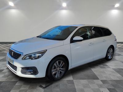 the white car is parked on a checkered tile floor