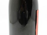 a bottle of wine that is sitting on a table