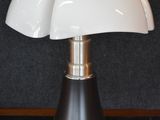 a lamp that is sitting on a table in a room
