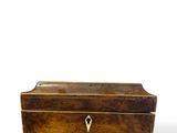 an old wooden box with a lock on top of it