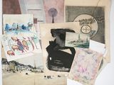 a lot of old papers and pictures on the table