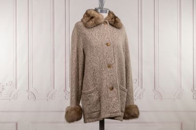 an image of a coat with a fur collar on a mannequin