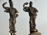 pair of antique brass figurines of a man and a woman