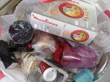 a basket full of household items sitting on a table