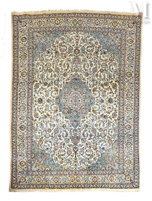 an antique persian rug with a medallion design
