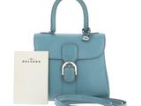 a small blue purse with a tag on it