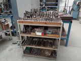 many tools that are sitting on a shelf in the room