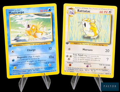 two pokemon cards that are on display on a table