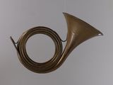 a brass instrument hanging from the ceiling in the room