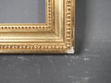 an image of a picture frame with gold paint on a gray background