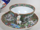 a cup and saucer sitting on a saucer