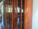 a large wooden window in the middle of a room