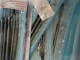 many dental tools in a plastic container on a table