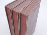 five books stacked on top of each other on a white surface