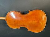 an antique violin on a black background