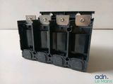 a close up of a group of black electrical switches on a white surface