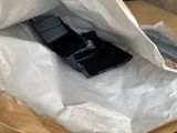 a cell phone inside of a plastic bag on a table