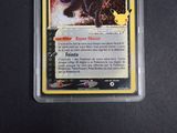 a close up of a pokemon card with a black cat on it