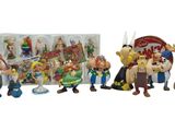 many figurines of cartoon characters in a row