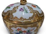 an image of a gold and white bowl with flowers on it