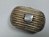 an image of a silver and gold ring with a stone in the middle
