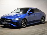 a blue mercedes cla parked in a garage