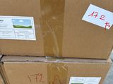 a stack of boxes sitting on a pallet with stickers on them